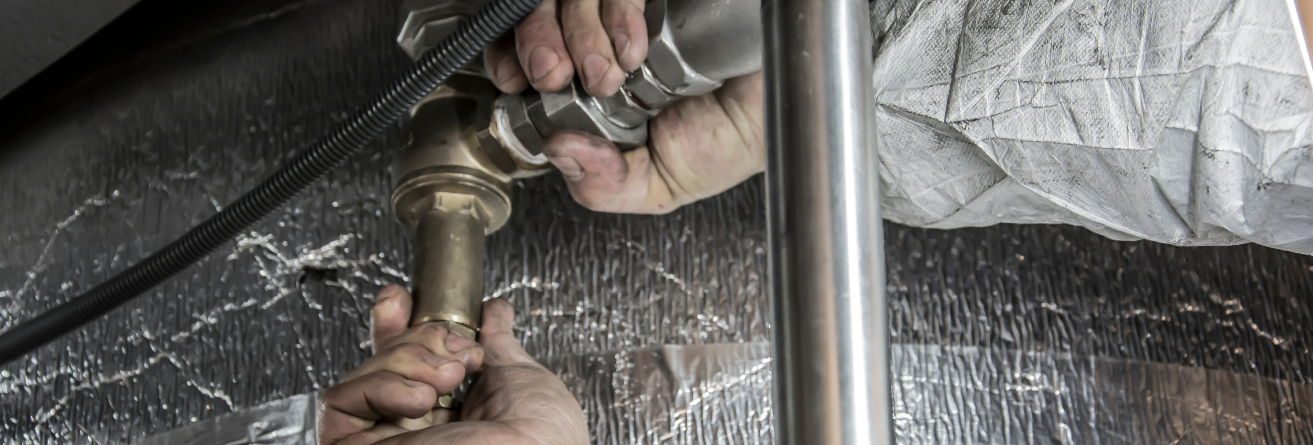 plumber working on job